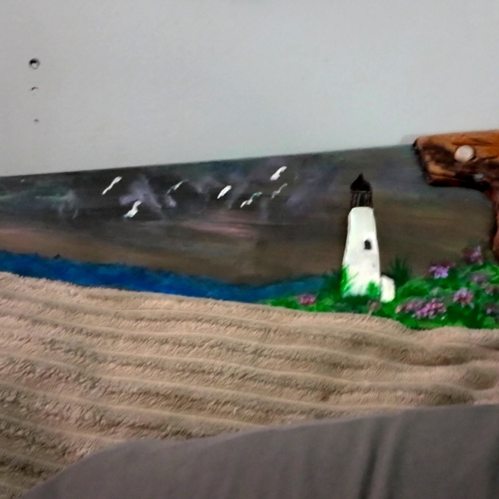 Vintage hand Saw painted with a refreshing sea art.